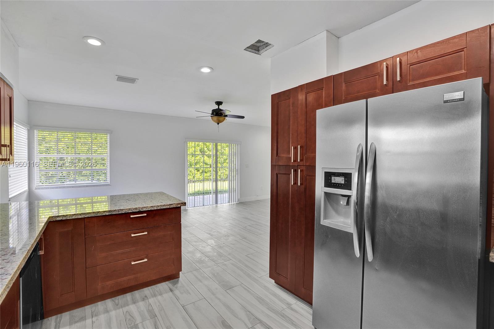 5721 Southwest 11th Street West Miami, FL 33144 - Photo 13 of 44 a kitchen with a refrigerator and window