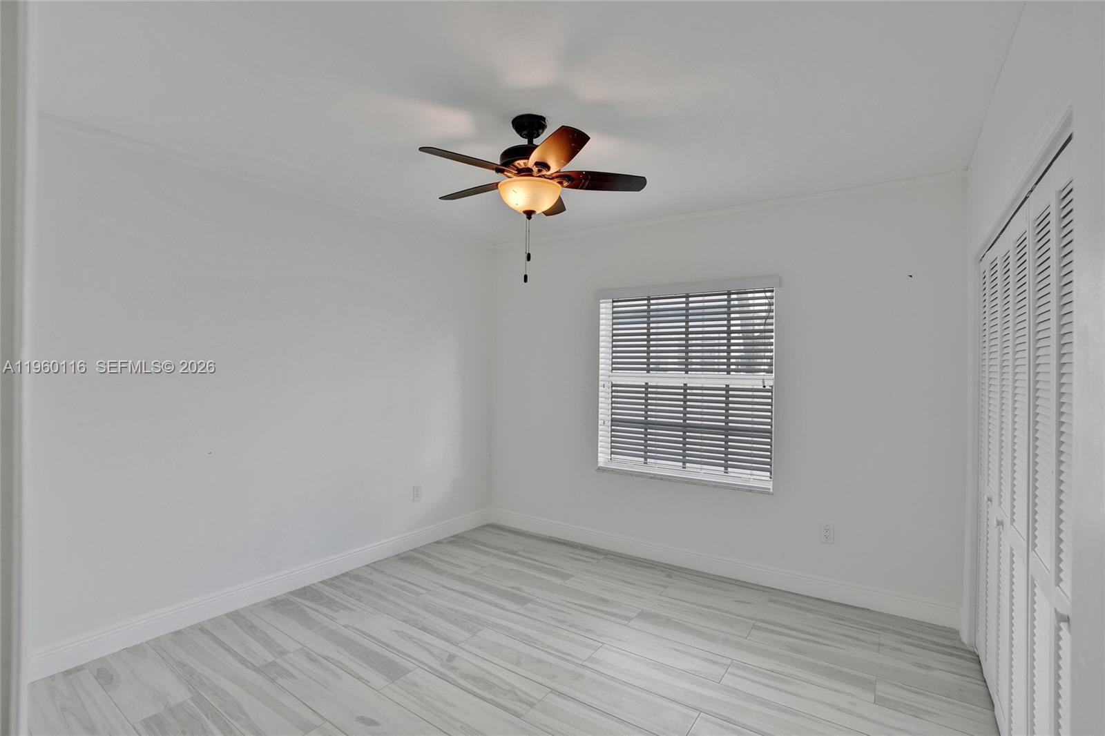 5721 Southwest 11th Street West Miami, FL 33144 - Photo 21 of 44 a view of an empty room with a window