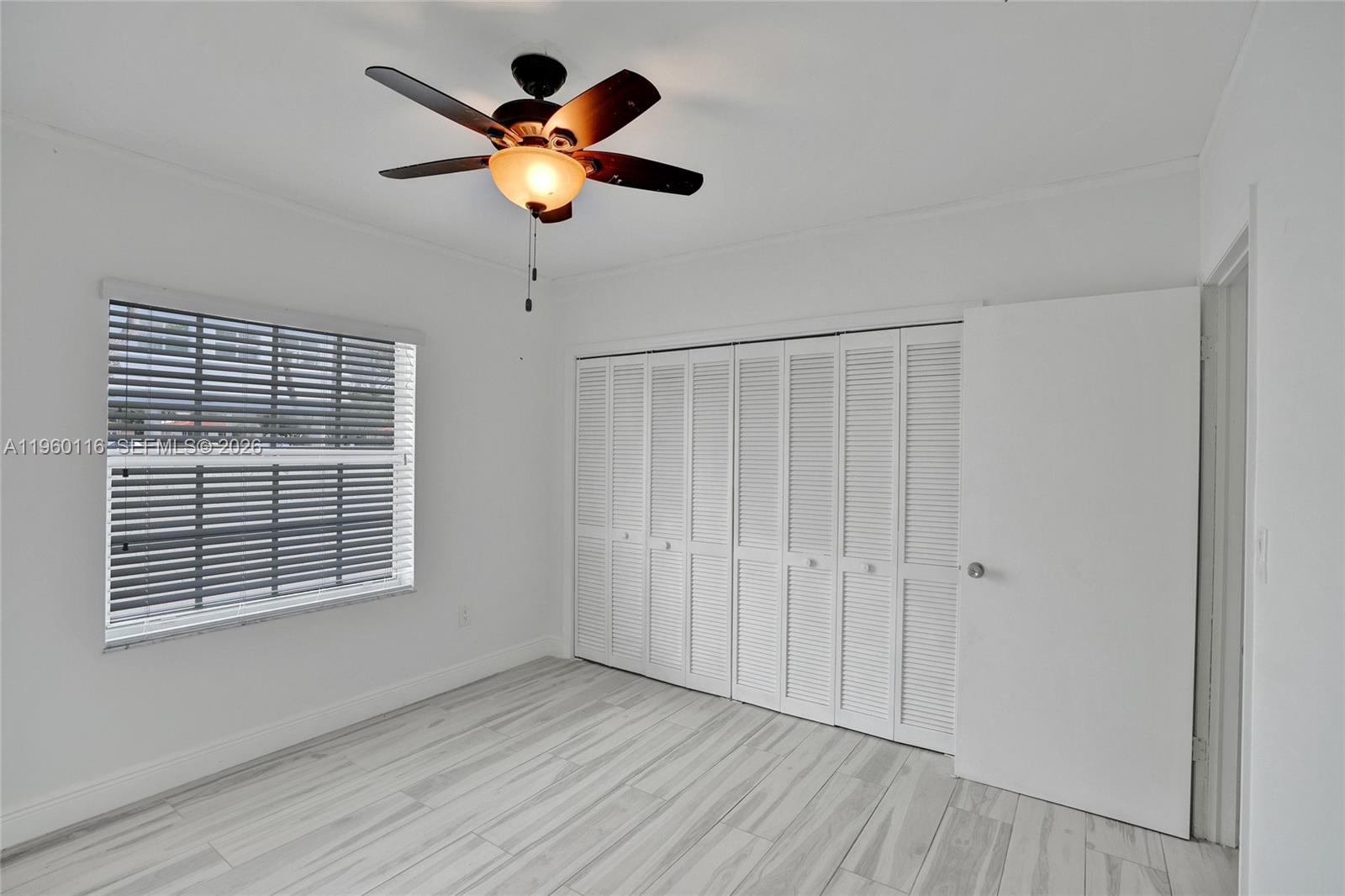 5721 Southwest 11th Street West Miami, FL 33144 - Photo 24 of 44 a view of an empty room with a window