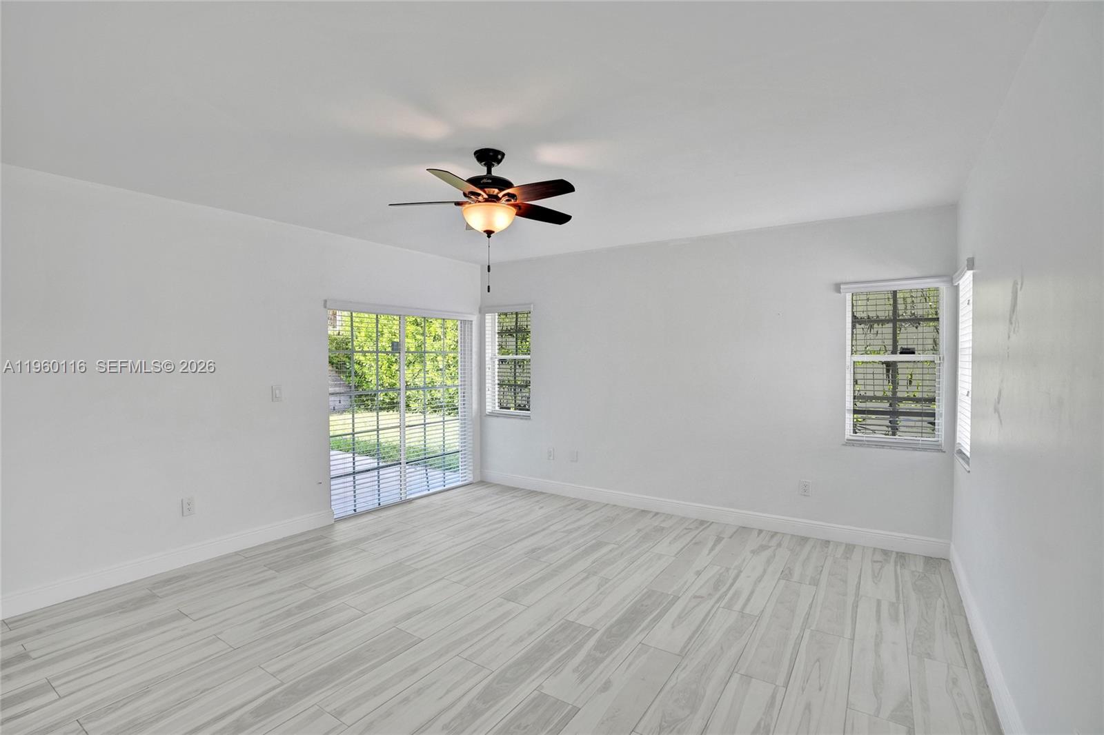 5721 Southwest 11th Street West Miami, FL 33144 - Photo 29 of 44 a view of an empty room with a window