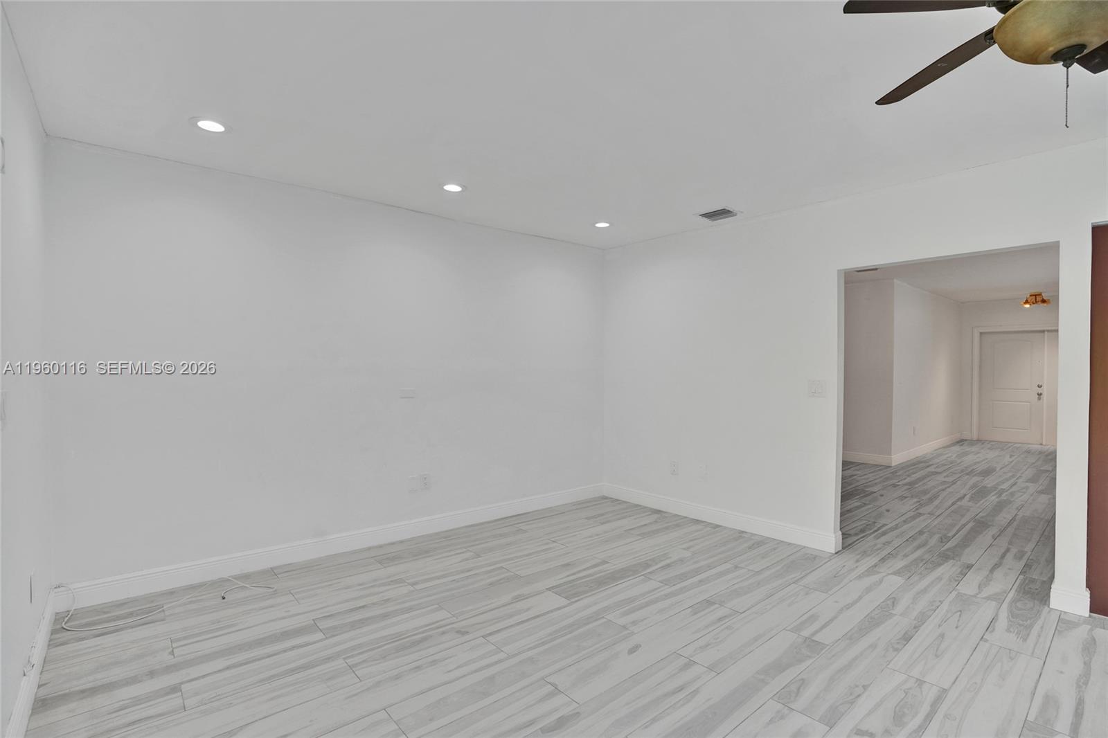 5721 Southwest 11th Street West Miami, FL 33144 - Photo 37 of 44 a view of an empty room with wooden floor