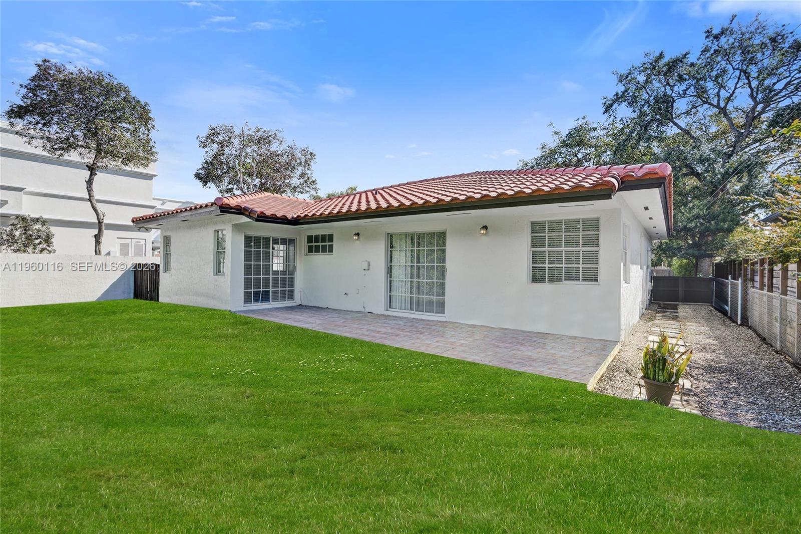 5721 Southwest 11th Street West Miami, FL 33144 - Photo 39 of 44 a view of a house with a yard