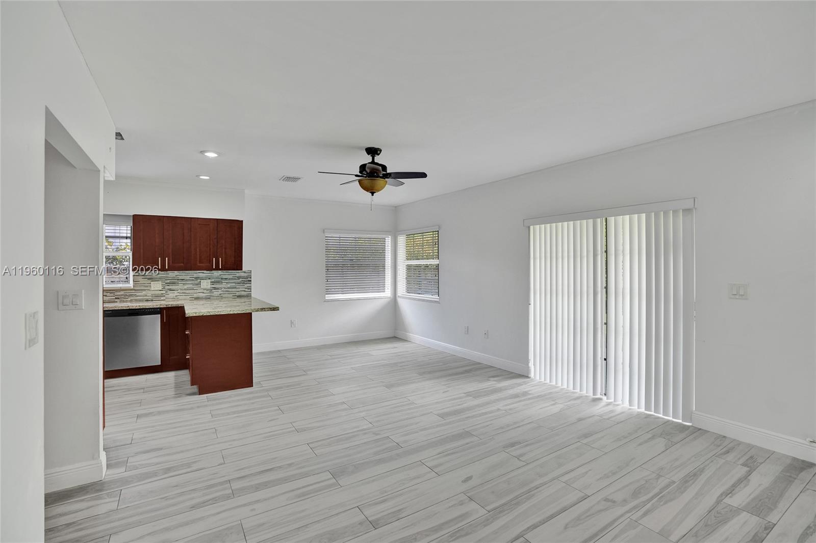 5721 Southwest 11th Street West Miami, FL 33144 - Photo 6 of 44 a view of kitchen with microwave oven a stove and a wooden floors