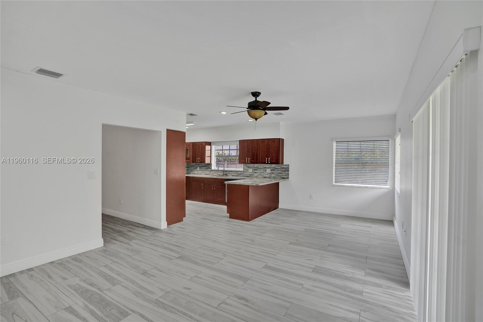 5721 Southwest 11th Street West Miami, FL 33144 - Photo 7 of 44 a room with wooden floors and cabinet