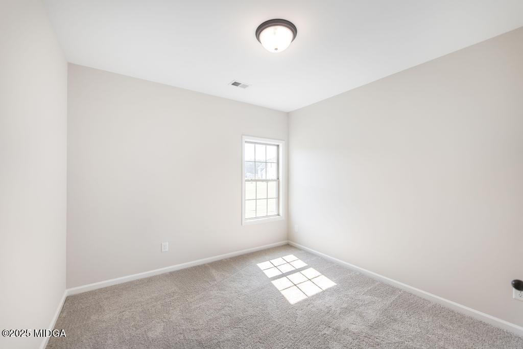 102 Black Birch Road, Unit 83G Perry, GA 31069 - Photo 13 of 31 an empty room with windows