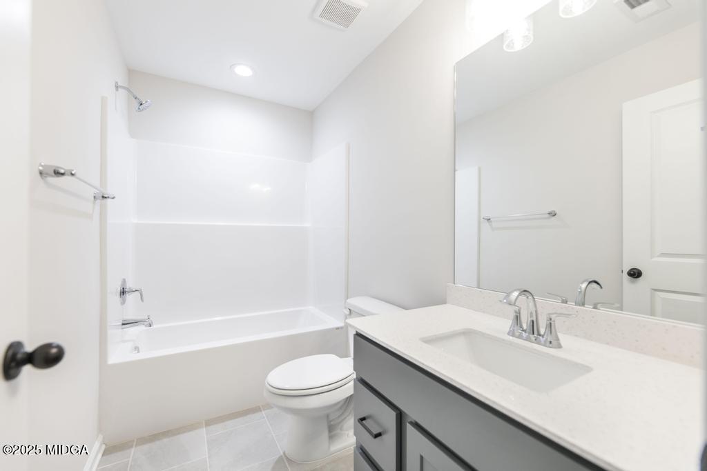 102 Black Birch Road, Unit 83G Perry, GA 31069 - Photo 21 of 31 a bathroom with a granite countertop sink a toilet and shower