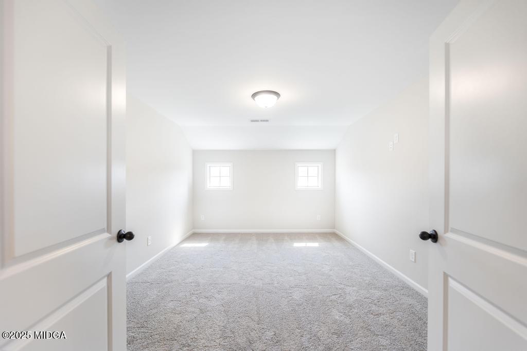 102 Black Birch Road, Unit 83G Perry, GA 31069 - Photo 24 of 31 a view of an empty room with a window