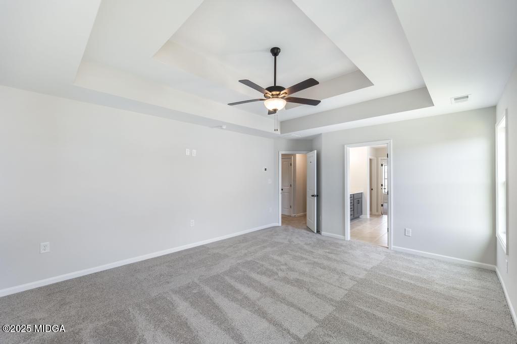 102 Black Birch Road, Unit 83G Perry, GA 31069 - Photo 26 of 31 a view of an empty room with a ceiling fan