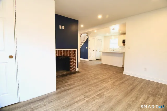 a view of a kitchen cabinets and wooden floor