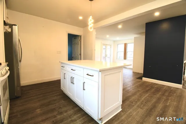 a bathroom with a sink a mirror and a shower