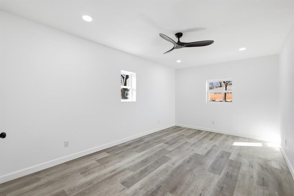 2900 Old Orchard Road Garland, TX 75041 - Photo 15 of 18 wooden floor in an empty room with a window