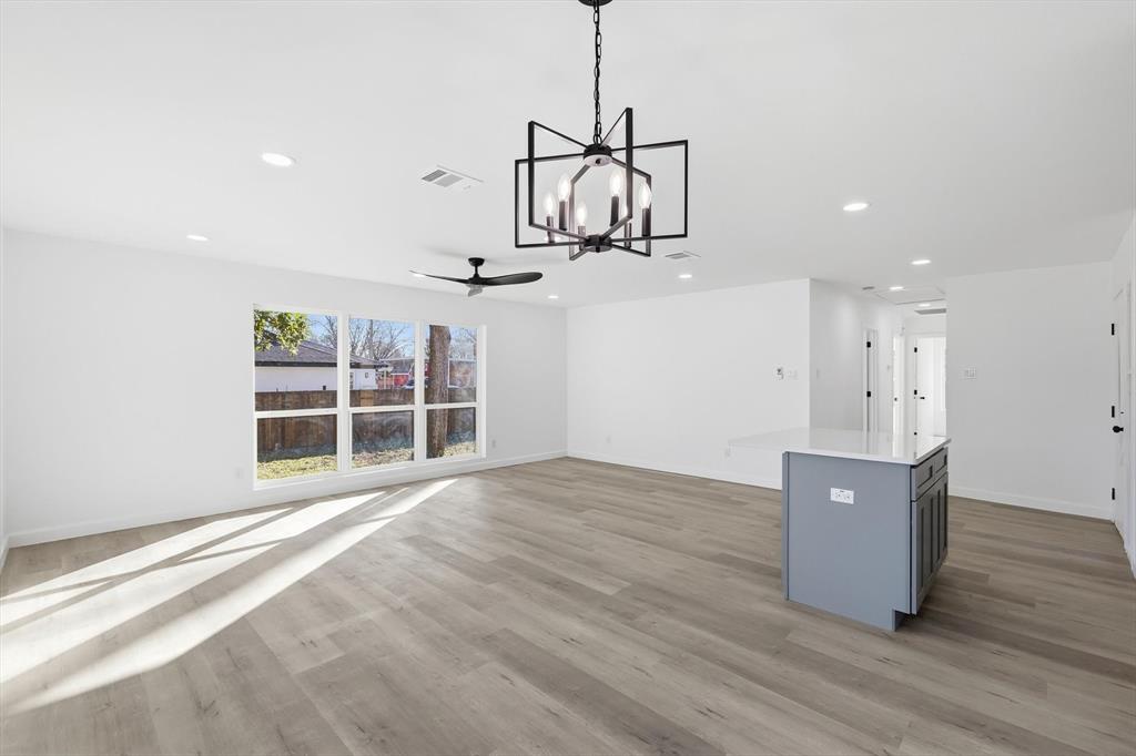 2900 Old Orchard Road Garland, TX 75041 - Photo 5 of 18 a view of a livingroom with furniture wooden floor and windows