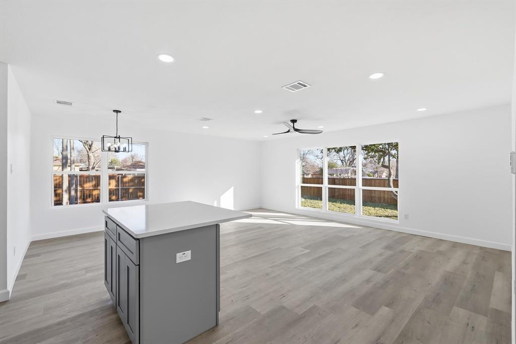 2900 Old Orchard Road Garland, TX 75041 - Photo 7 of 18 an empty room with wooden floor and windows