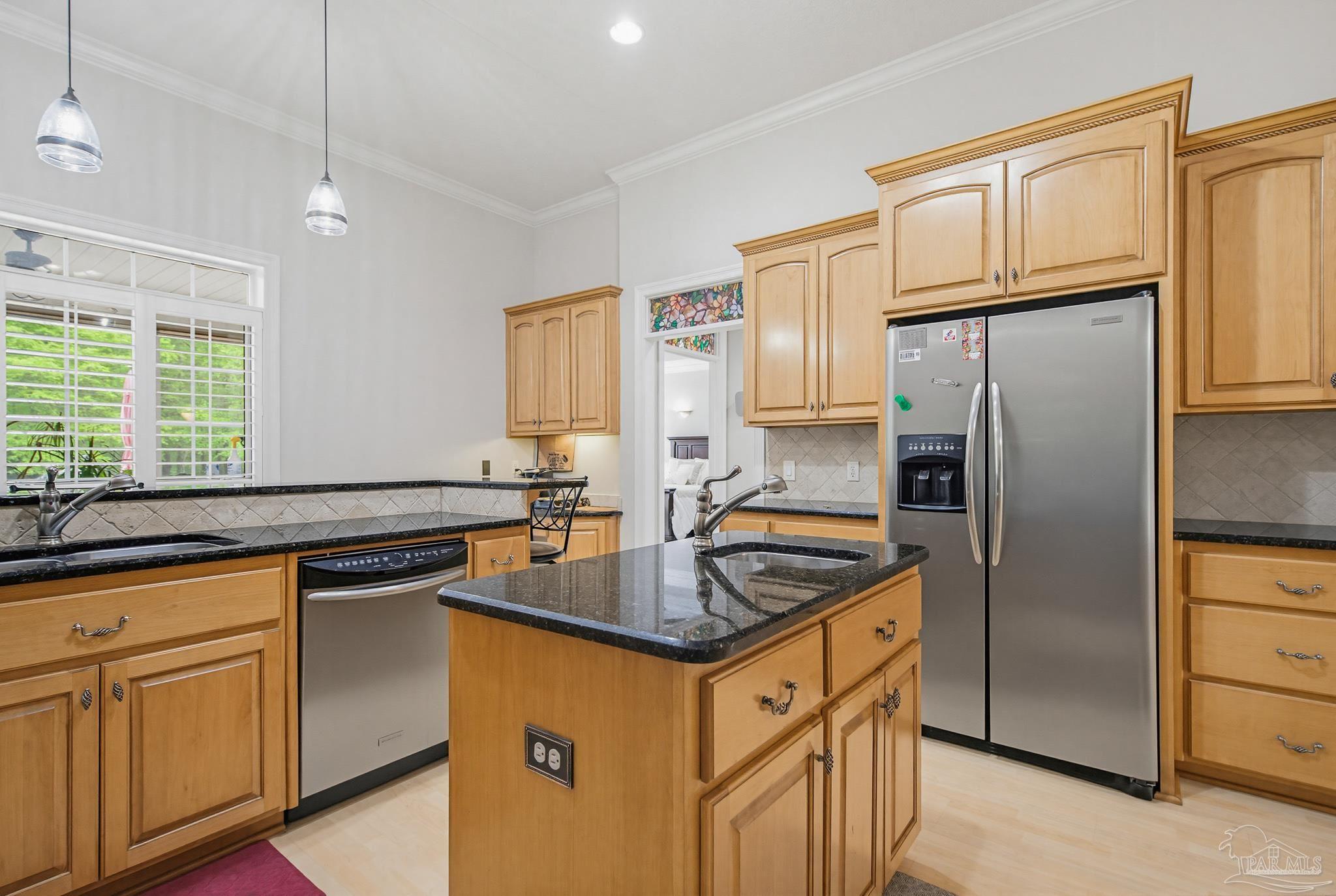 2855 Walling Road Milton, FL 32570 - Photo 21 of 55 a kitchen with stainless steel appliances granite countertop a sink stove and refrigerator