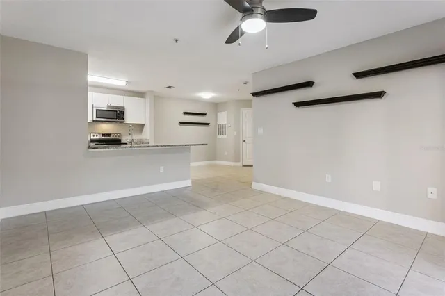 a view of a kitchen with a sink and cabinets