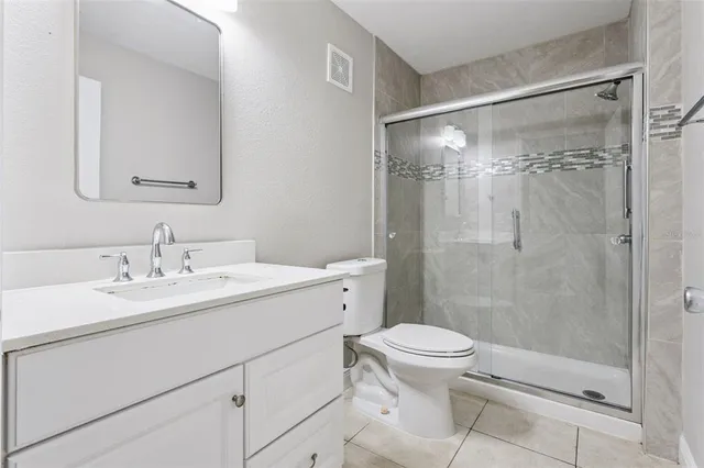 a spacious bedroom with a large bed and a window