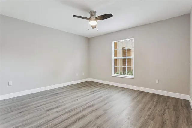 a view of a room with wooden floor