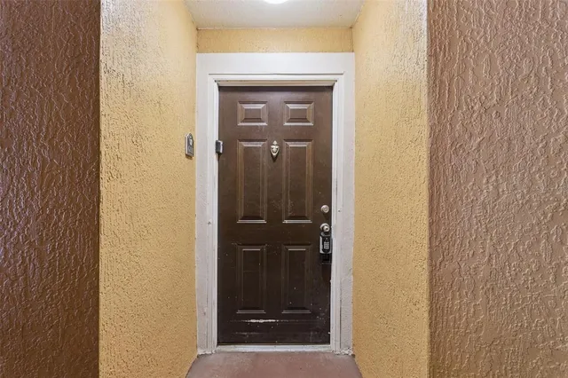 a view of a bathroom from a hallway