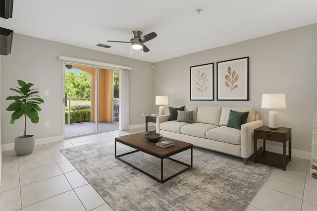 a living room with furniture and a large window