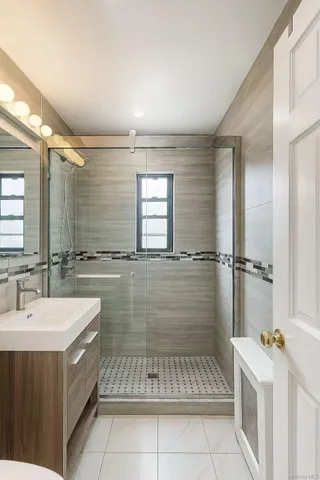 a bathroom with a sink a mirror and a bathtub