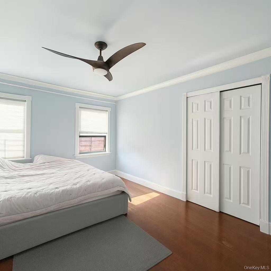196-36 67th Avenue, Unit 1 Queens, NY 11365 - Photo 10 of 10 a bedroom with a bed and a window