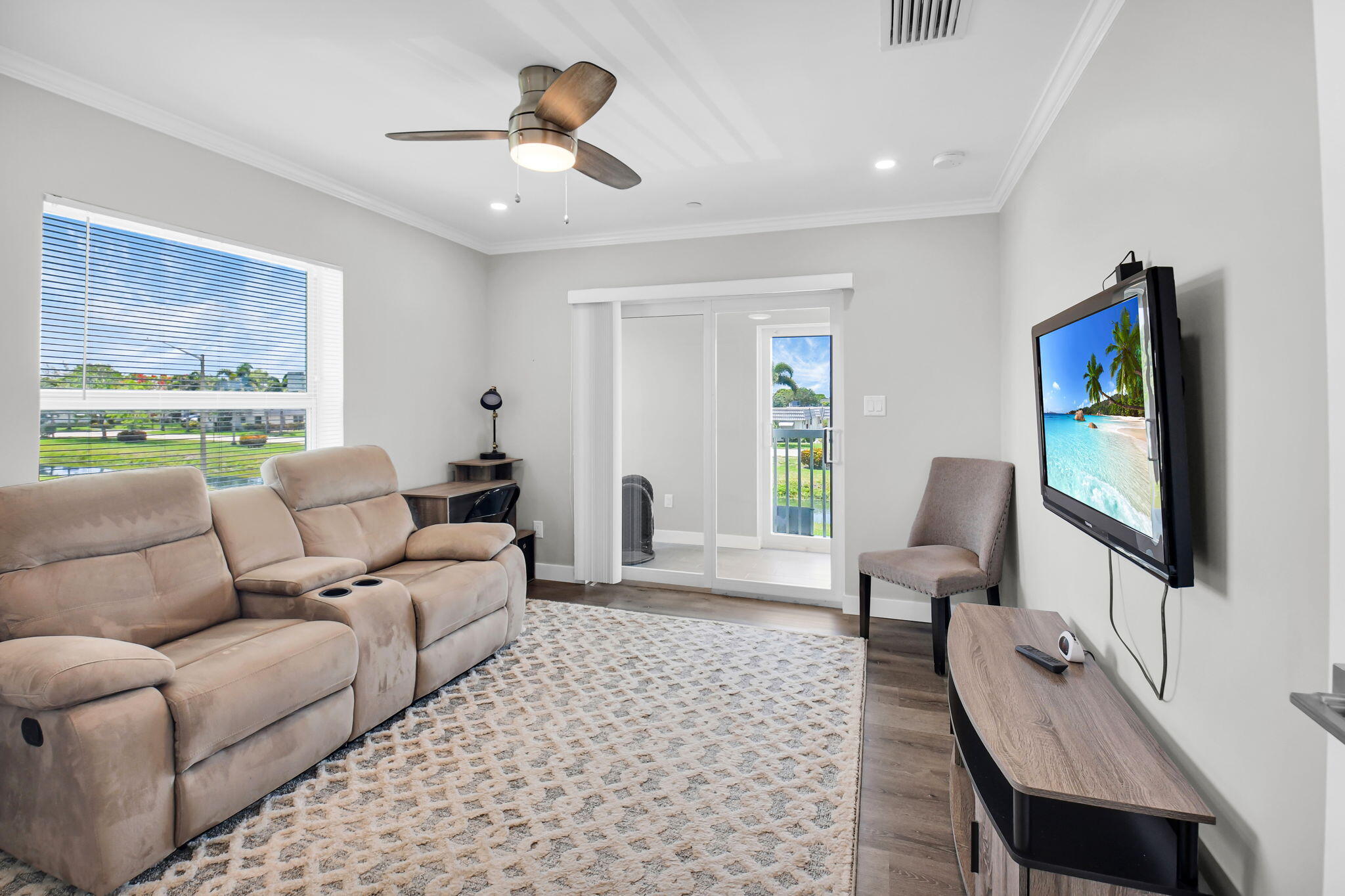 388 Tuscany Lane, Unit 388 Delray Beach, FL 33446 - Photo 27 of 89 a living room with furniture and a flat screen tv