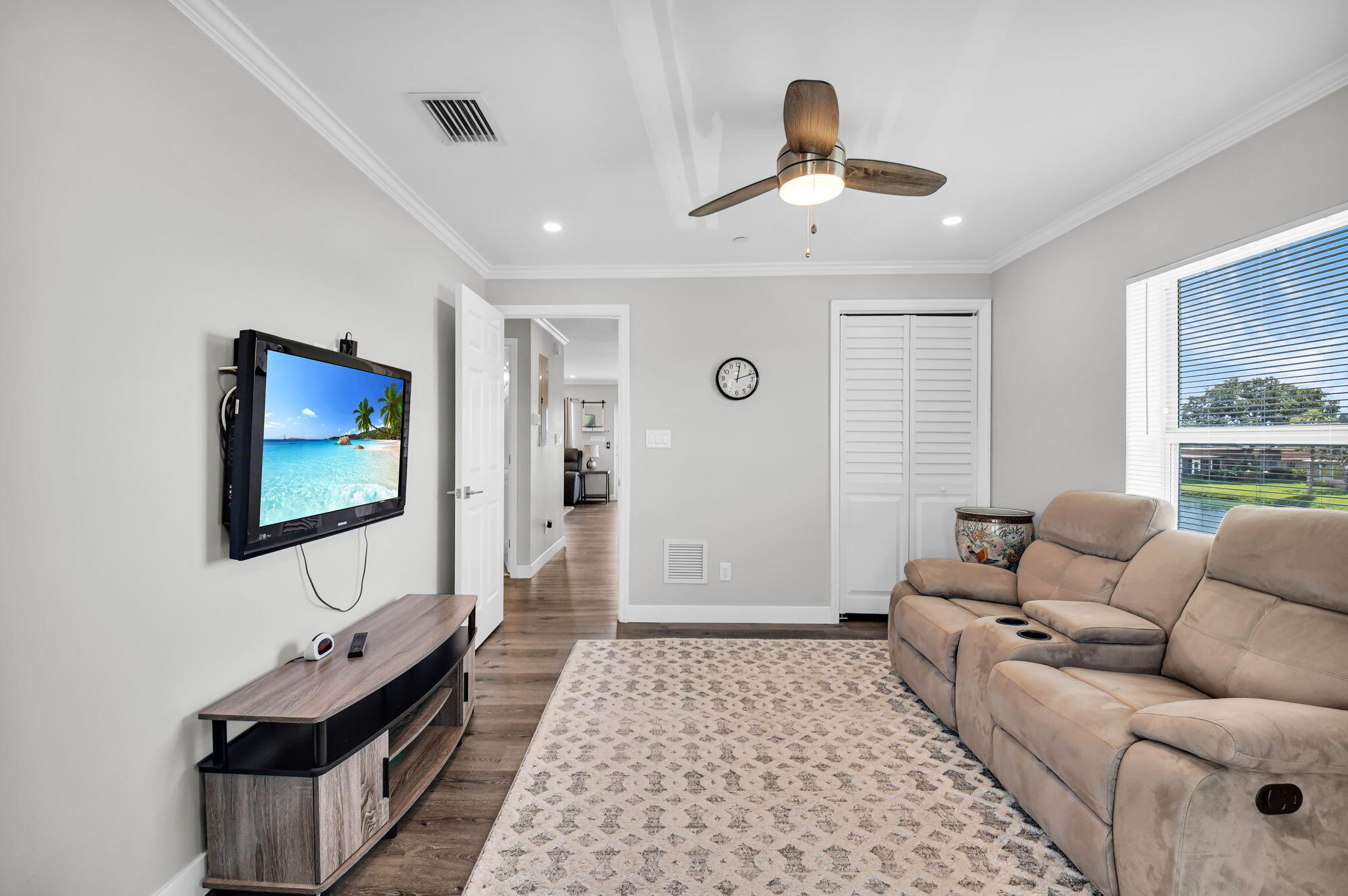 388 Tuscany Lane, Unit 388 Delray Beach, FL 33446 - Photo 29 of 89 a living room with furniture and a flat screen tv