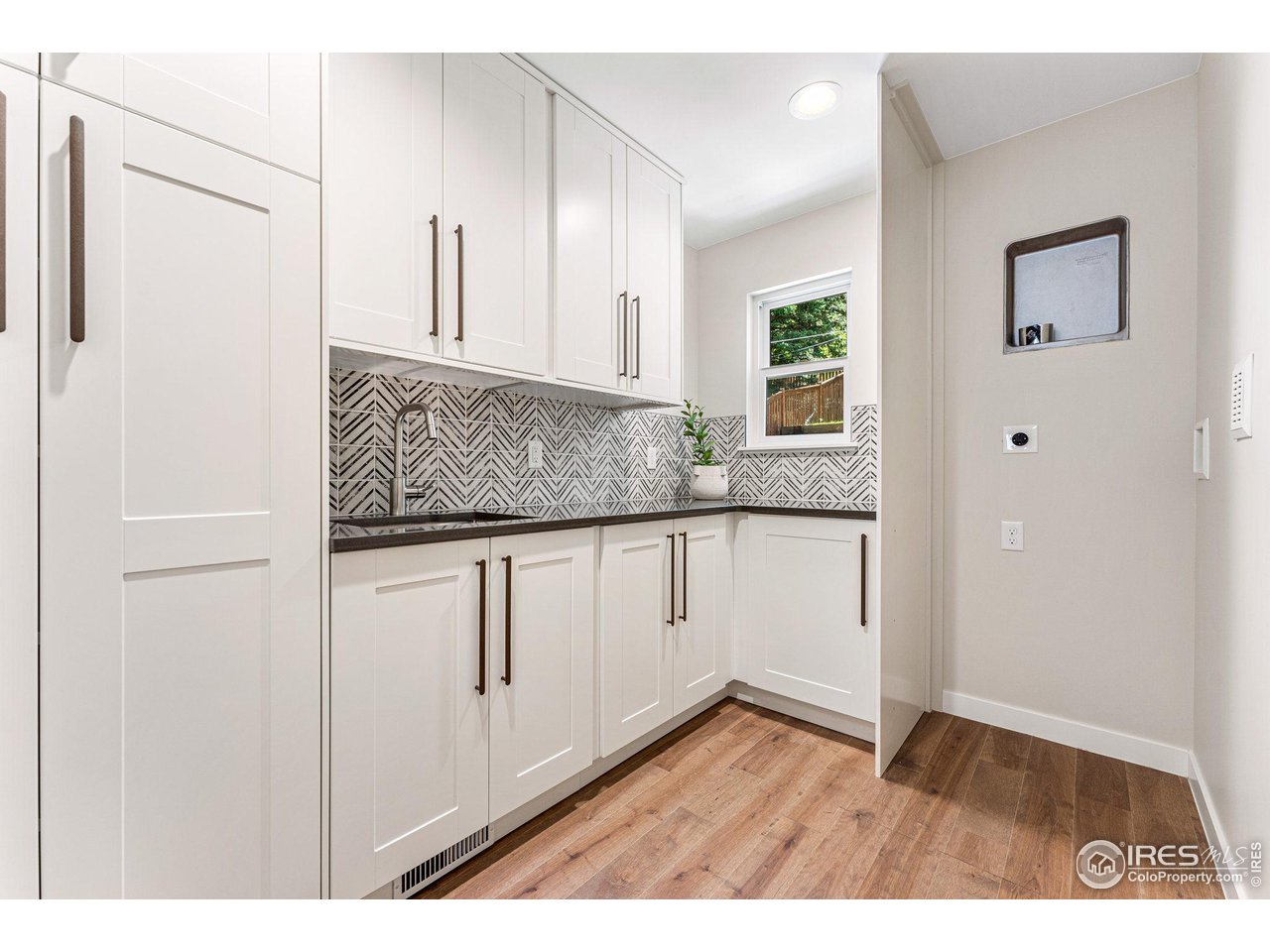 1616 North Street Boulder, CO 80304 - Photo 22 of 32 a view of a kitchen with cabinets and wooden floor