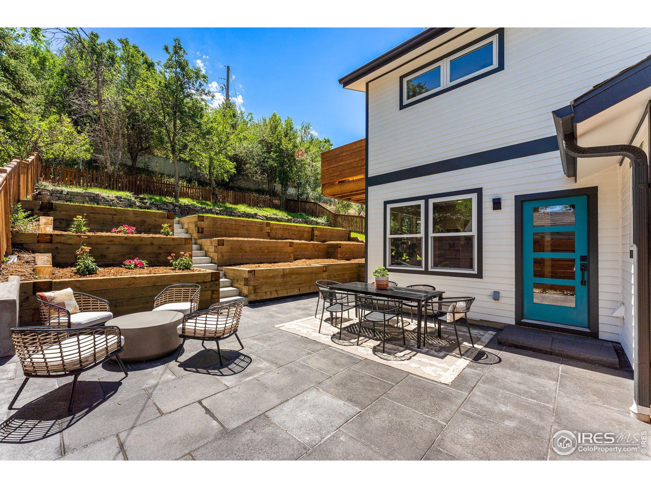 1616 North Street Boulder, CO 80304 - Photo 26 of 32 a view of a patio with table and chairs with wooden floor and fence