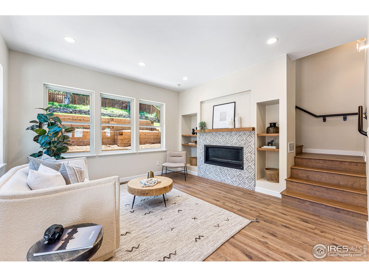 1616 North Street Boulder, CO 80304 - Photo 5 of 32 a living room with furniture and a fireplace