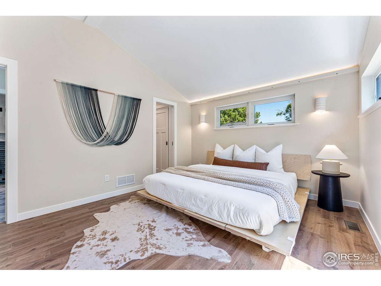 1616 North Street Boulder, CO 80304 - Photo 10 of 32 a bedroom with a bed and a painting on the wall