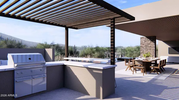 a view of a patio with couches table and chairs under an umbrella with a fire pit and barbeque grill