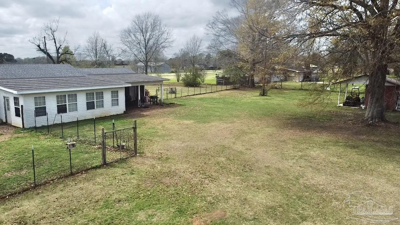 887 Old Bratt Road Atmore, AL 36502 - Photo 25 of 41 front view of a house with a yard