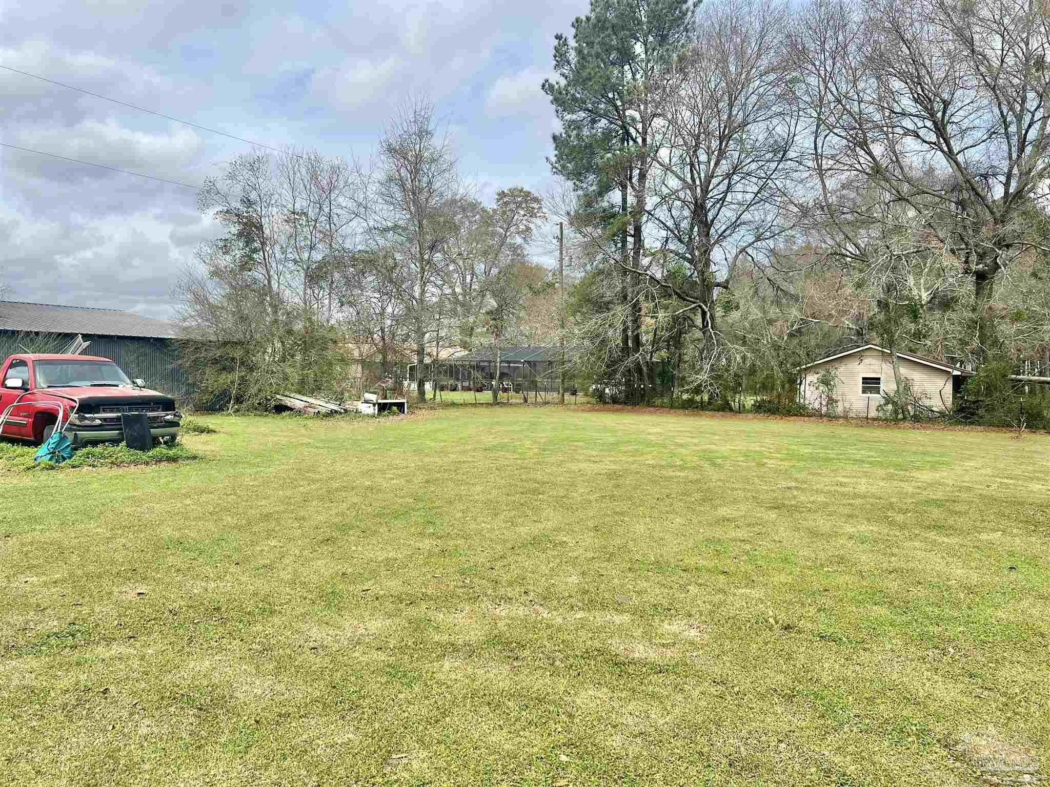 887 Old Bratt Road Atmore, AL 36502 - Photo 31 of 41 a view of yard with swimming pool and green space