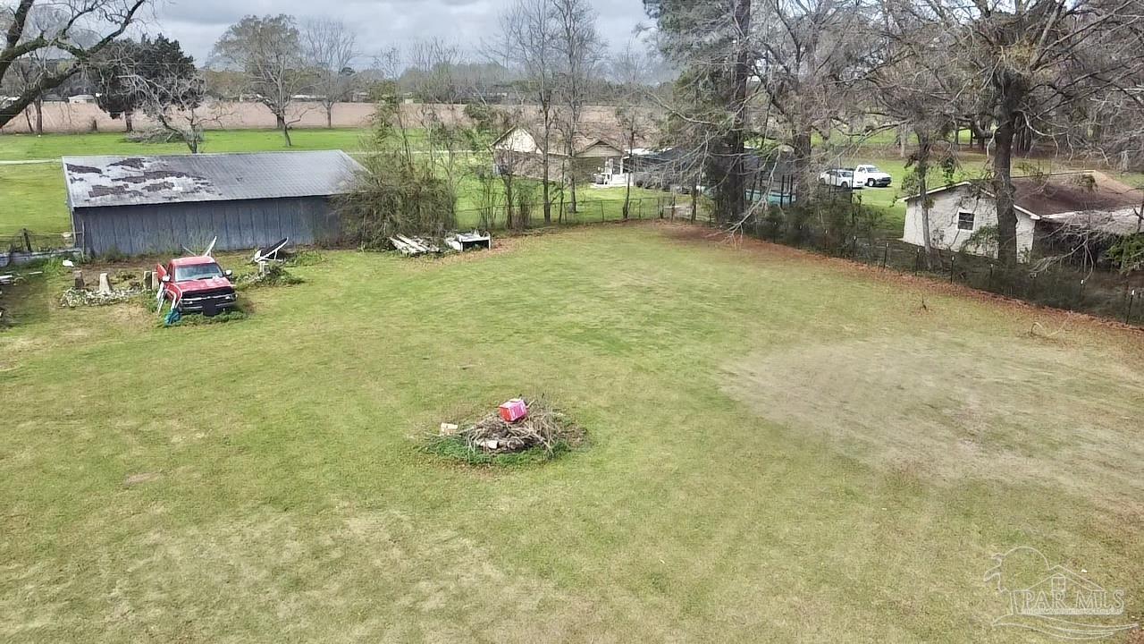 887 Old Bratt Road Atmore, AL 36502 - Photo 35 of 41 a view of a tree in front of a house