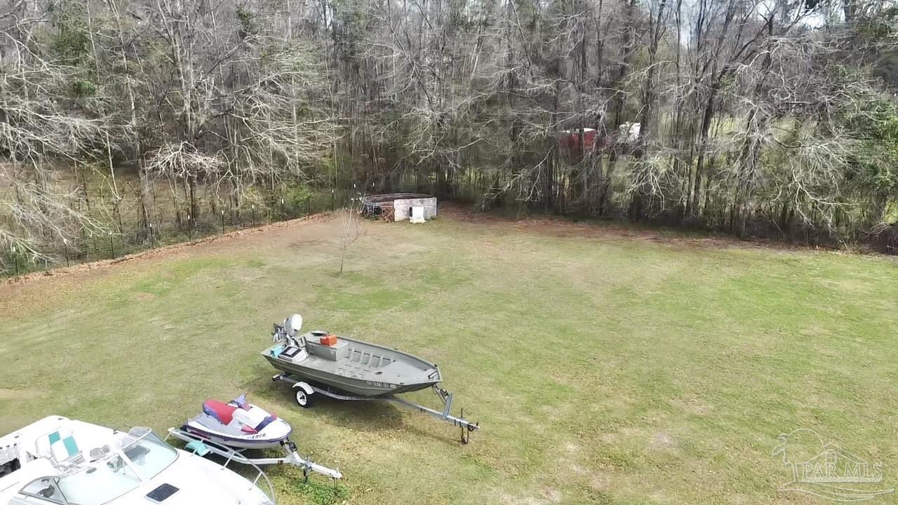 887 Old Bratt Road Atmore, AL 36502 - Photo 37 of 41 a backyard of a house with lots of green space
