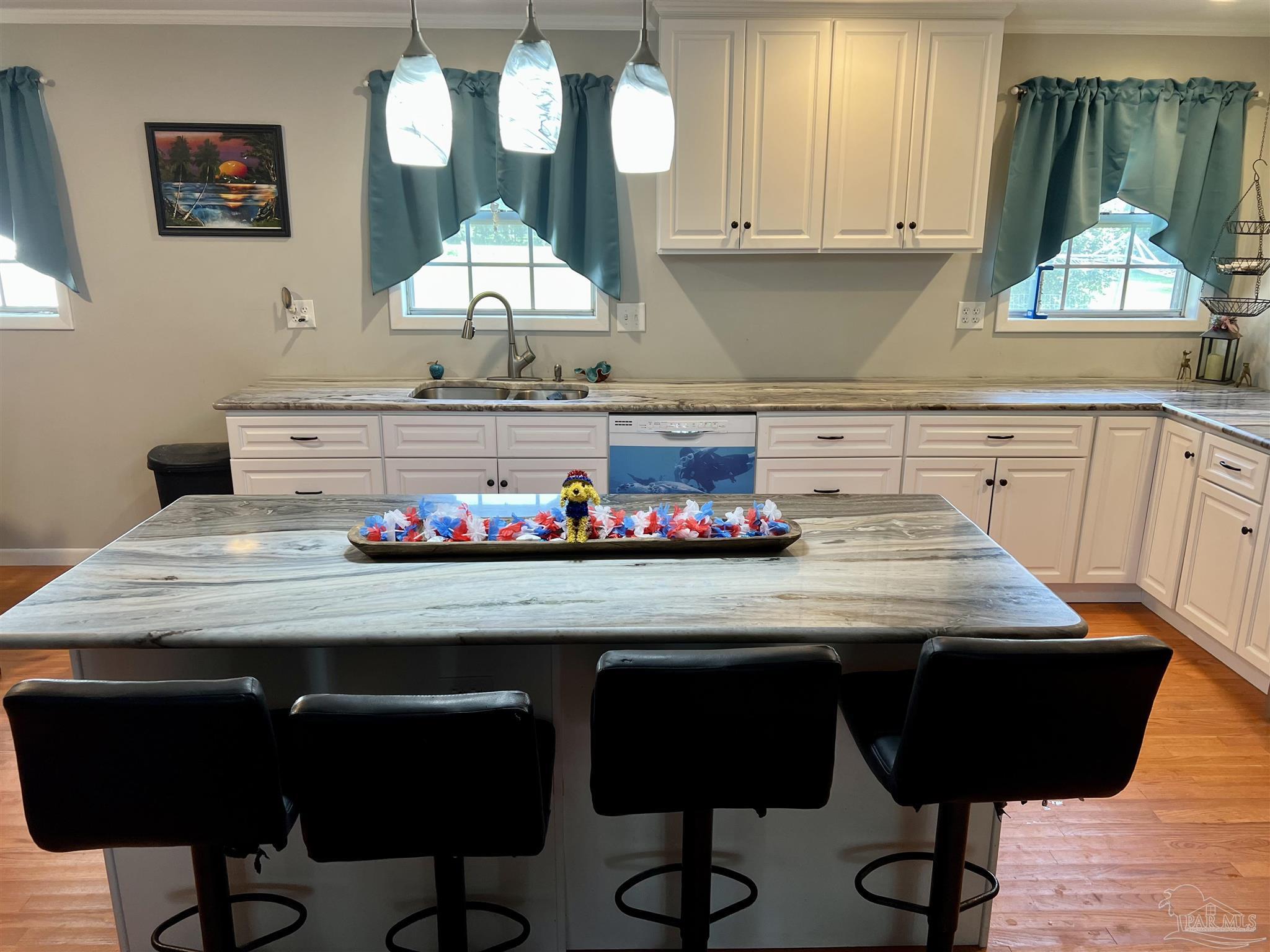 887 Old Bratt Road Atmore, AL 36502 - Photo 5 of 41 a room with granite countertop wooden floor