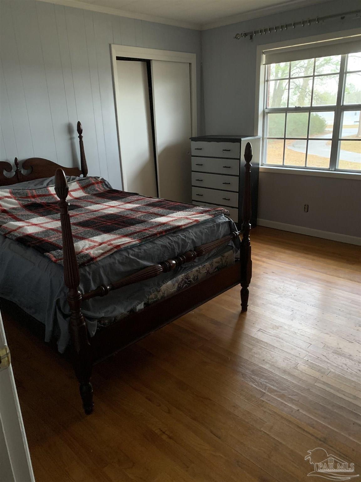 887 Old Bratt Road Atmore, AL 36502 - Photo 9 of 41 a bedroom with a bed and window