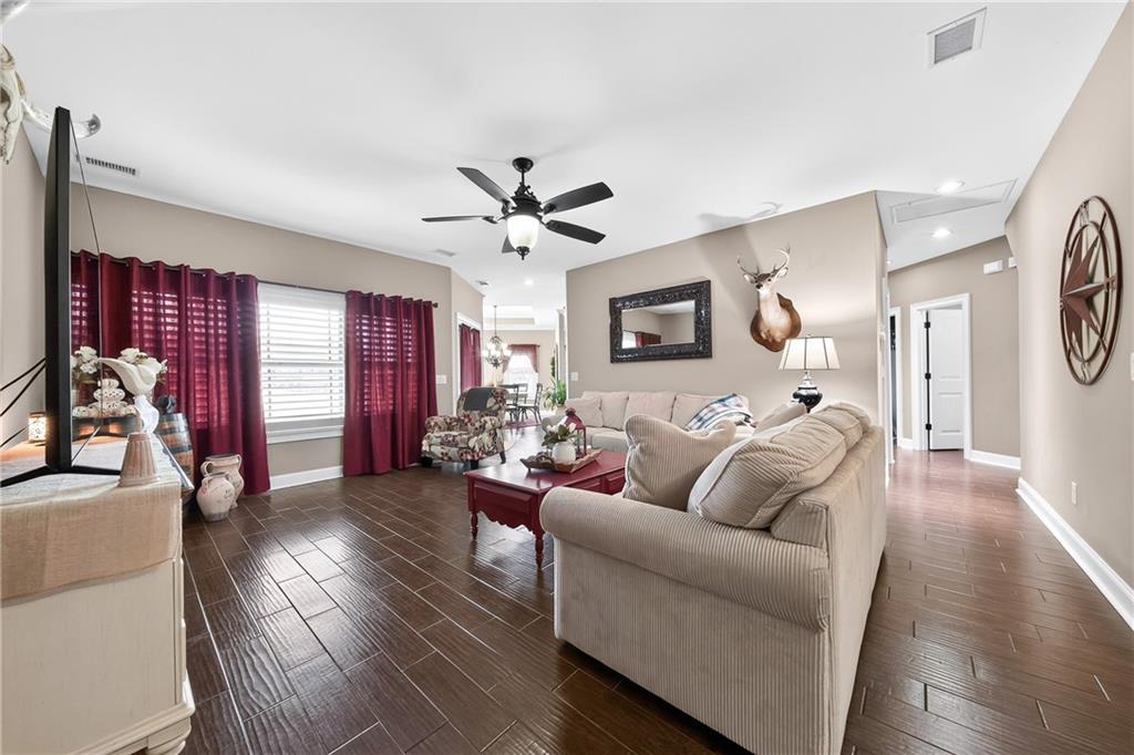 611 Padgetts Road Opelika, AL 36804 - Photo 10 of 64 Wood-finish flooring, ceiling fan with integrated lighting, recessed lighting, and white interior doors