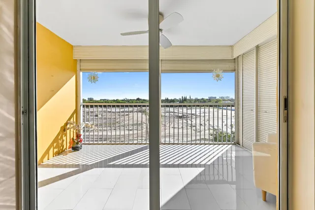 a roof deck with couches and city view
