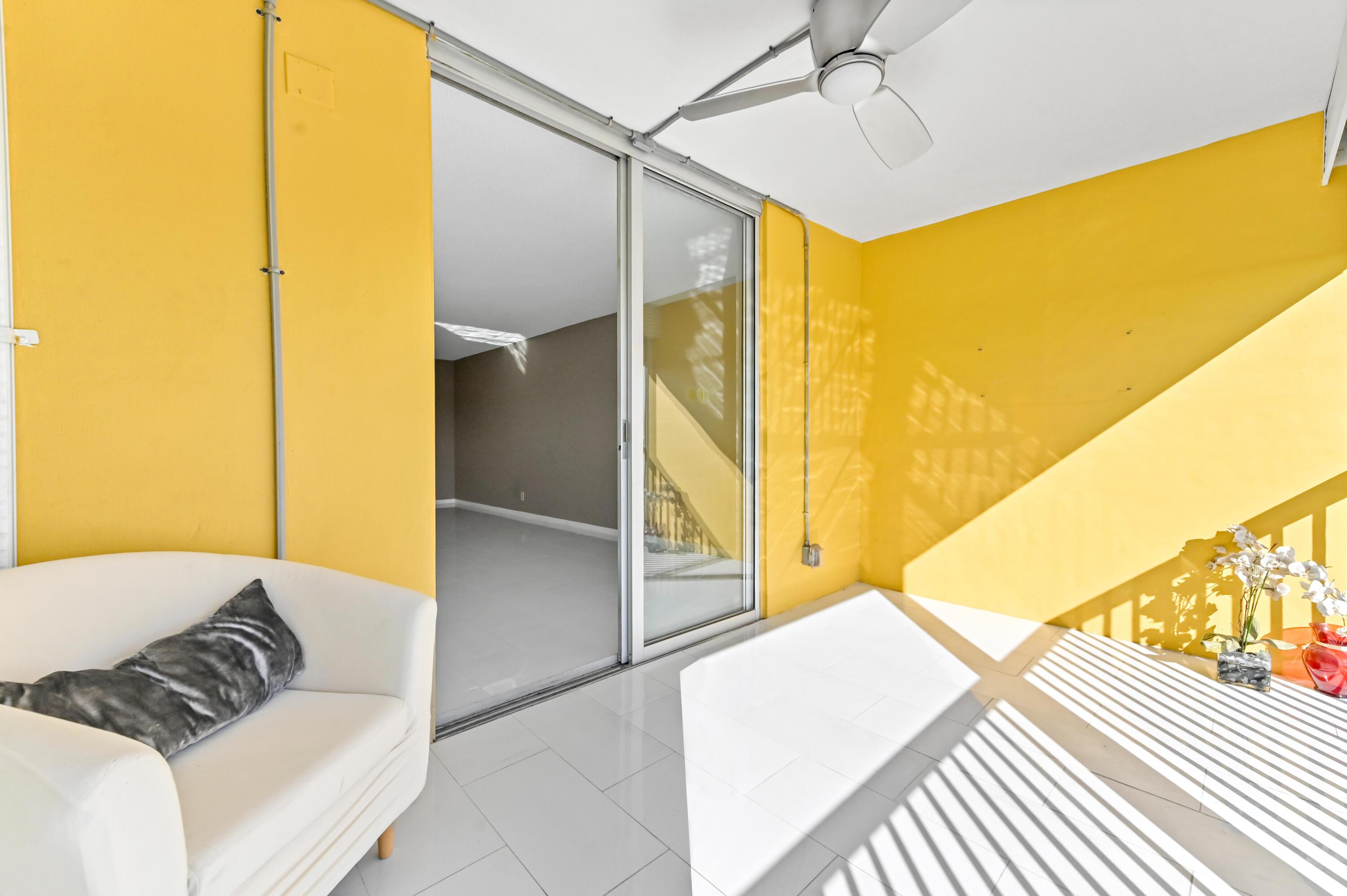 5700 Northwest 2nd Avenue, Unit 503 Boca Raton, FL 33487 - Photo 29 of 40 a bedroom with a bed and wooden floor