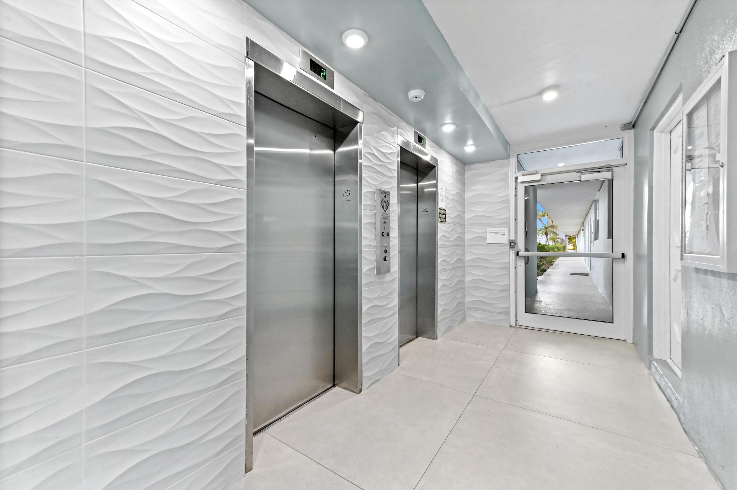 5700 Northwest 2nd Avenue, Unit 503 Boca Raton, FL 33487 - Photo 31 of 40 a view of a hallway