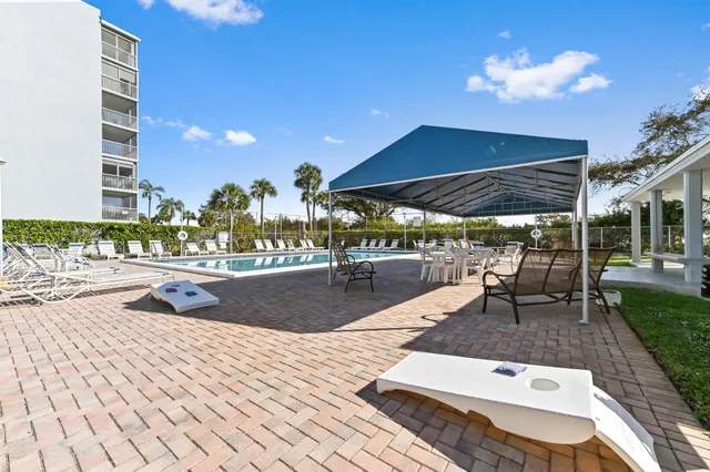 a view of a swimming pool with a lounge chair