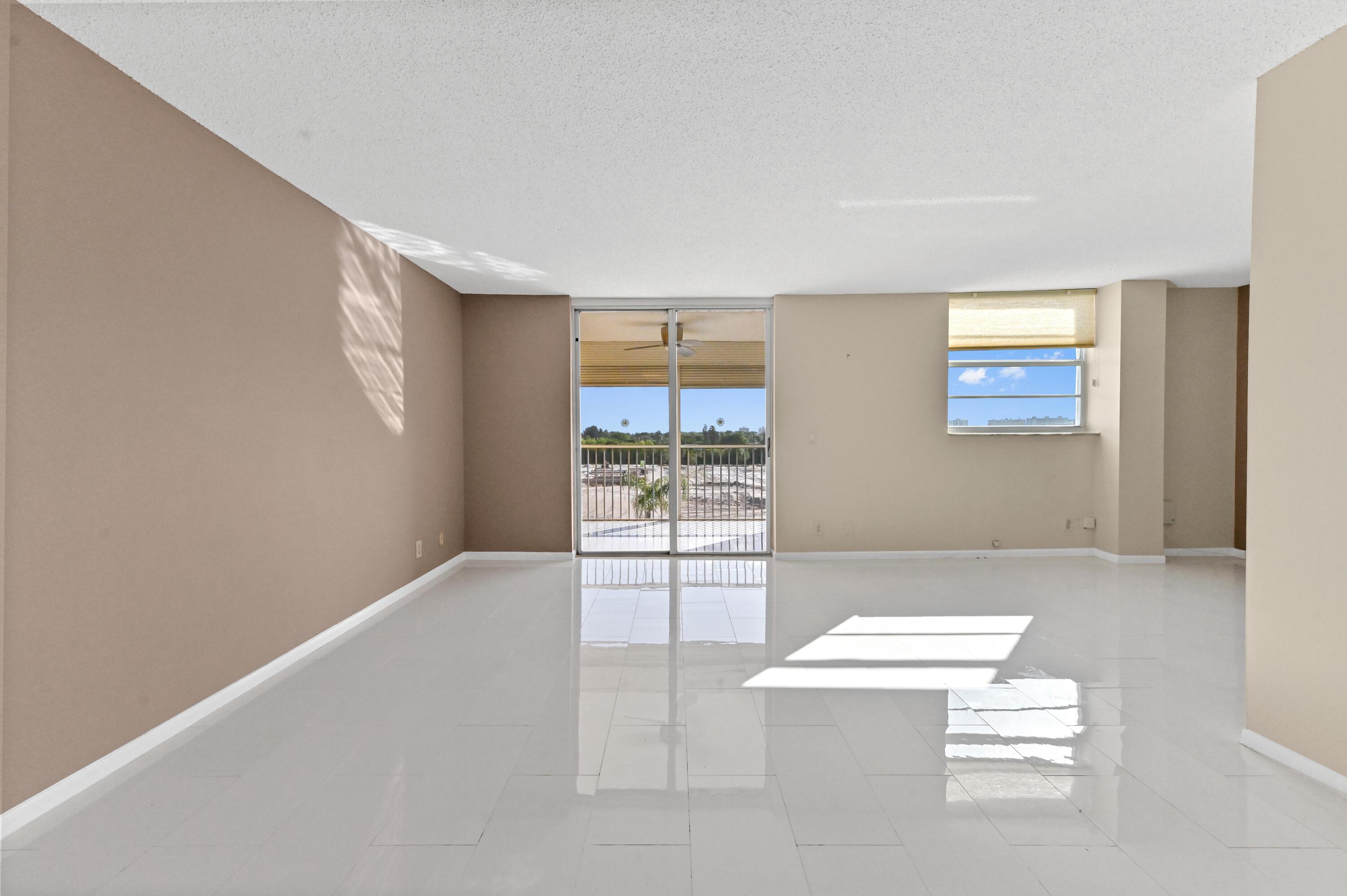 5700 Northwest 2nd Avenue, Unit 503 Boca Raton, FL 33487 - Photo 7 of 40 an empty room with windows
