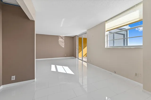 a kitchen with a sink and refrigerator