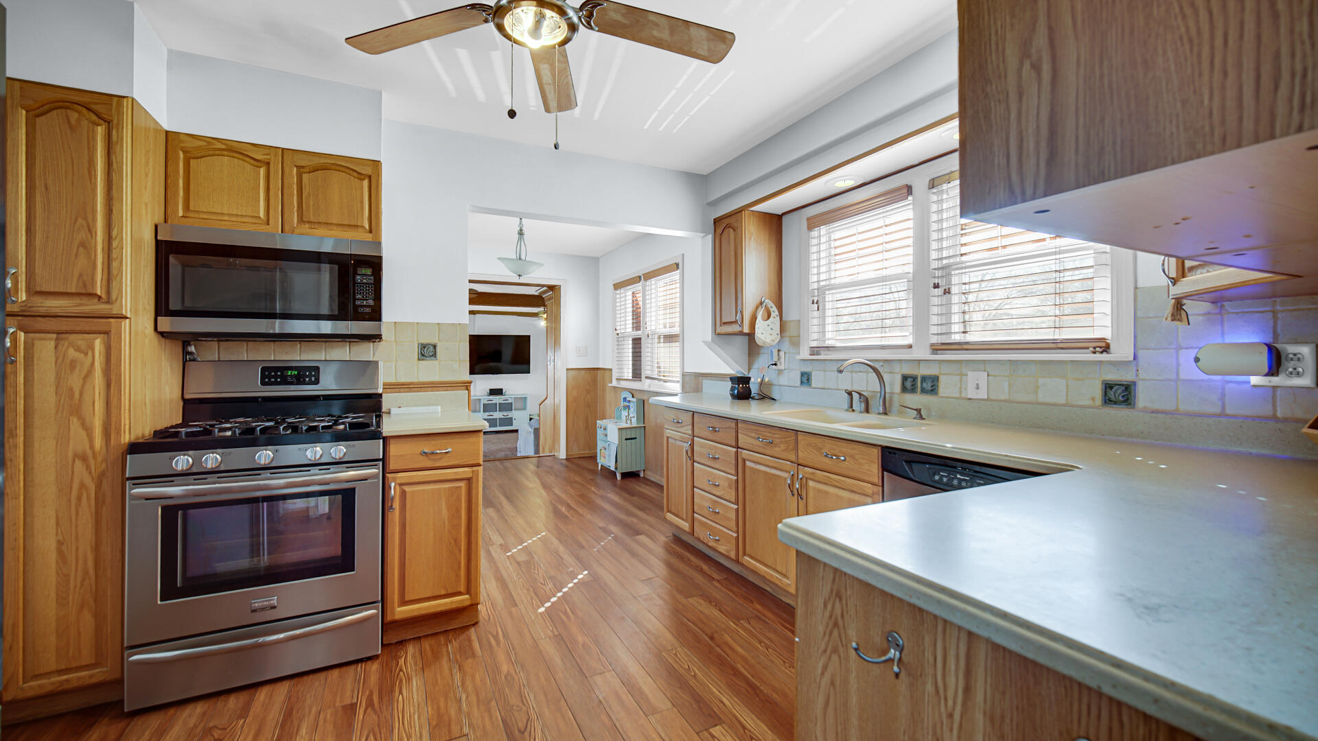222 Beacon Place Munster, IN 46321 - Photo 11 of 30 a kitchen with stainless steel appliances a stove a sink and a microwave