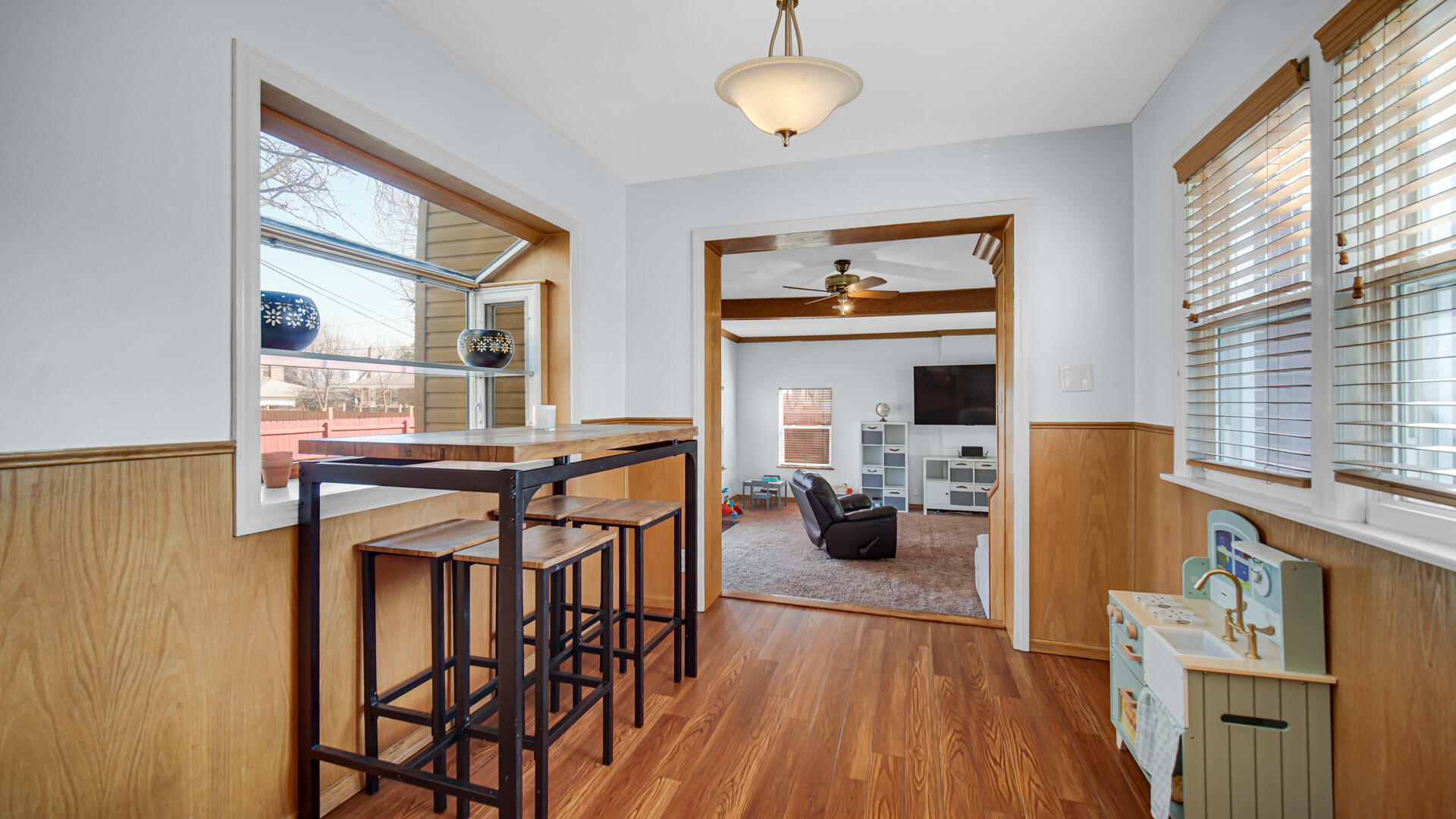 222 Beacon Place Munster, IN 46321 - Photo 13 of 30 a view of a dining room with furniture window and wooden floor