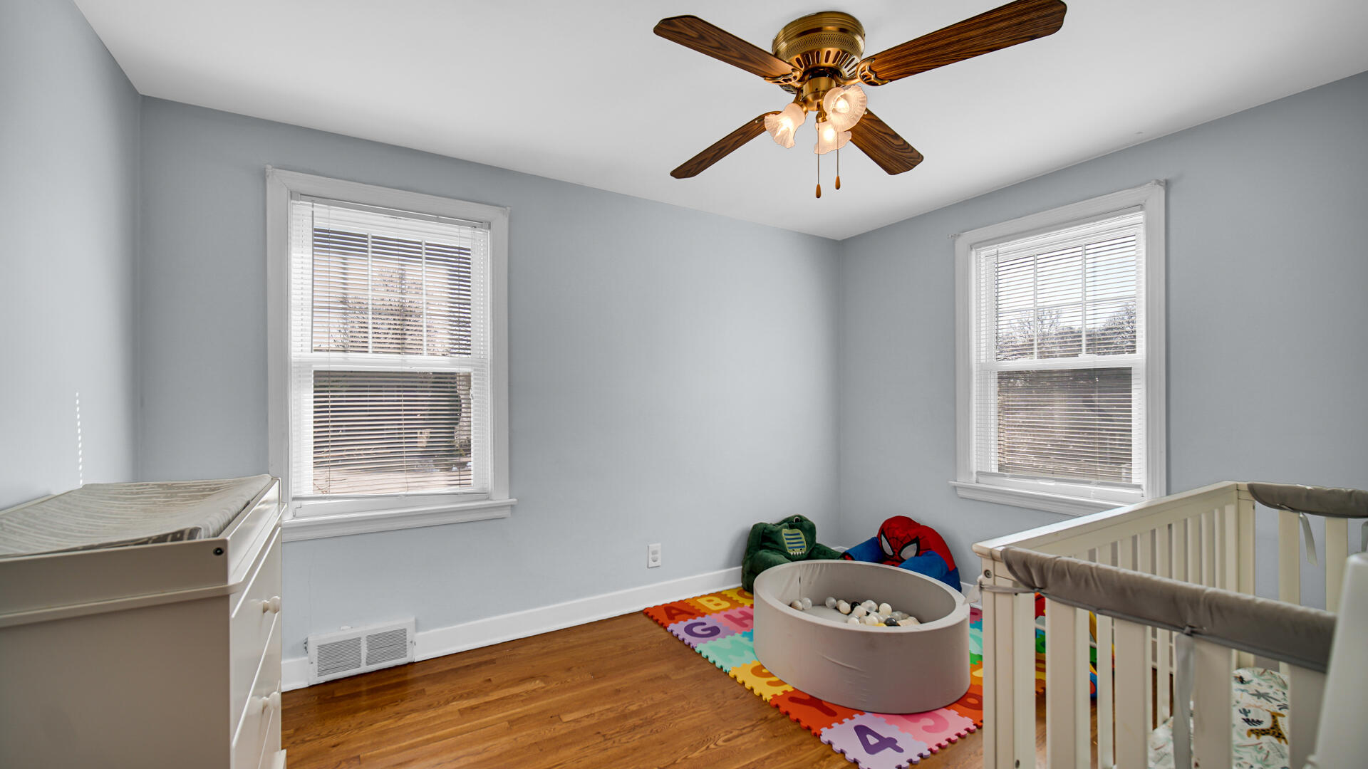 222 Beacon Place Munster, IN 46321 - Photo 16 of 30 a living room with a bed and a window