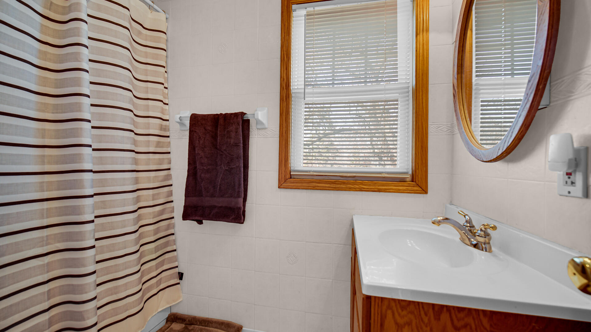 222 Beacon Place Munster, IN 46321 - Photo 20 of 30 a bathroom with a sink and a mirror