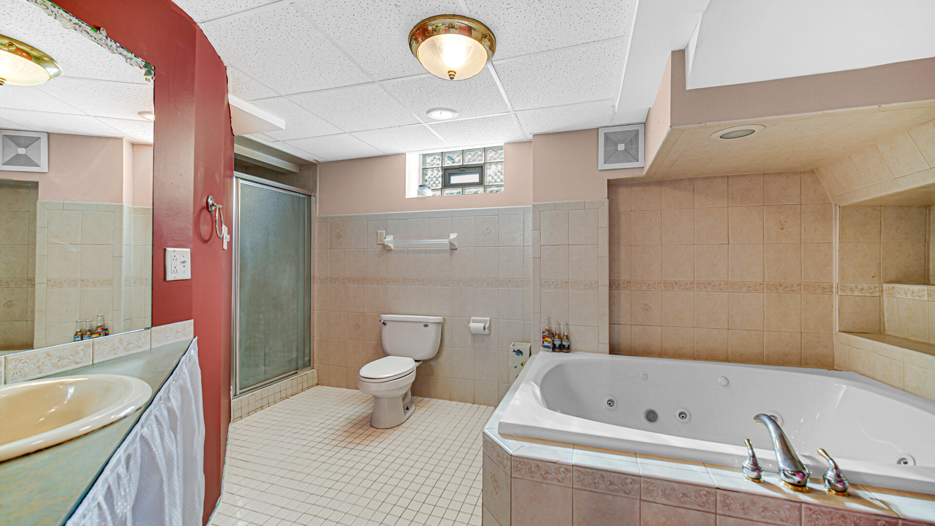 222 Beacon Place Munster, IN 46321 - Photo 23 of 30 a bathroom with a tub a sink and a large mirror